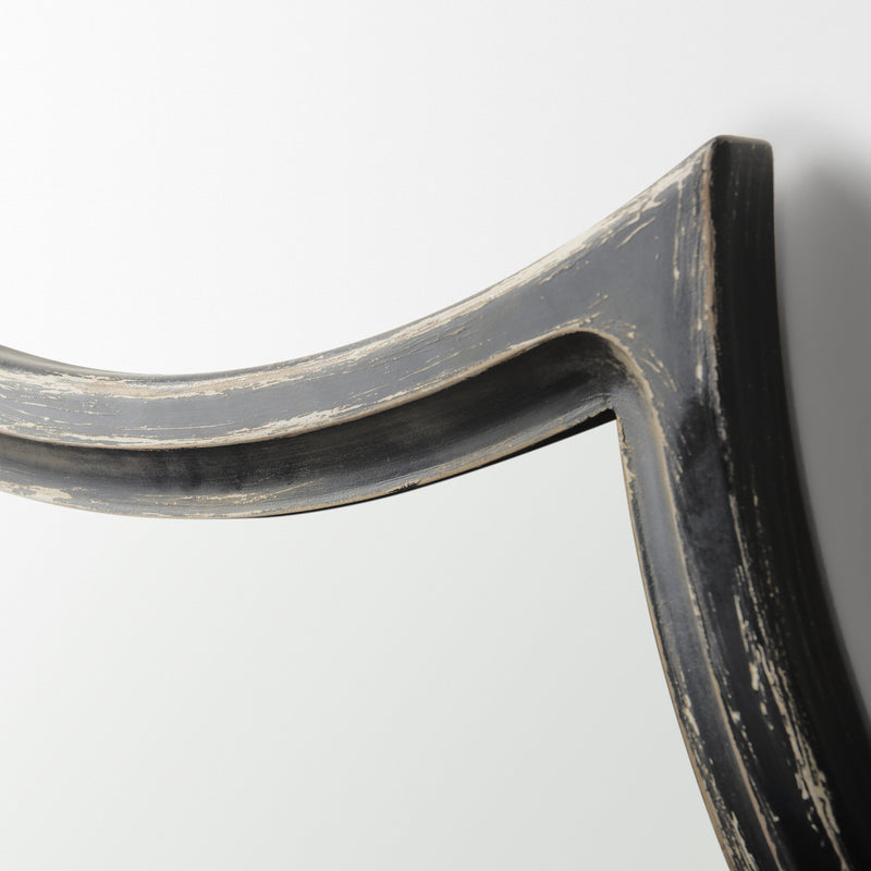 Detail of curved frame corner with distressed black and light gray finish