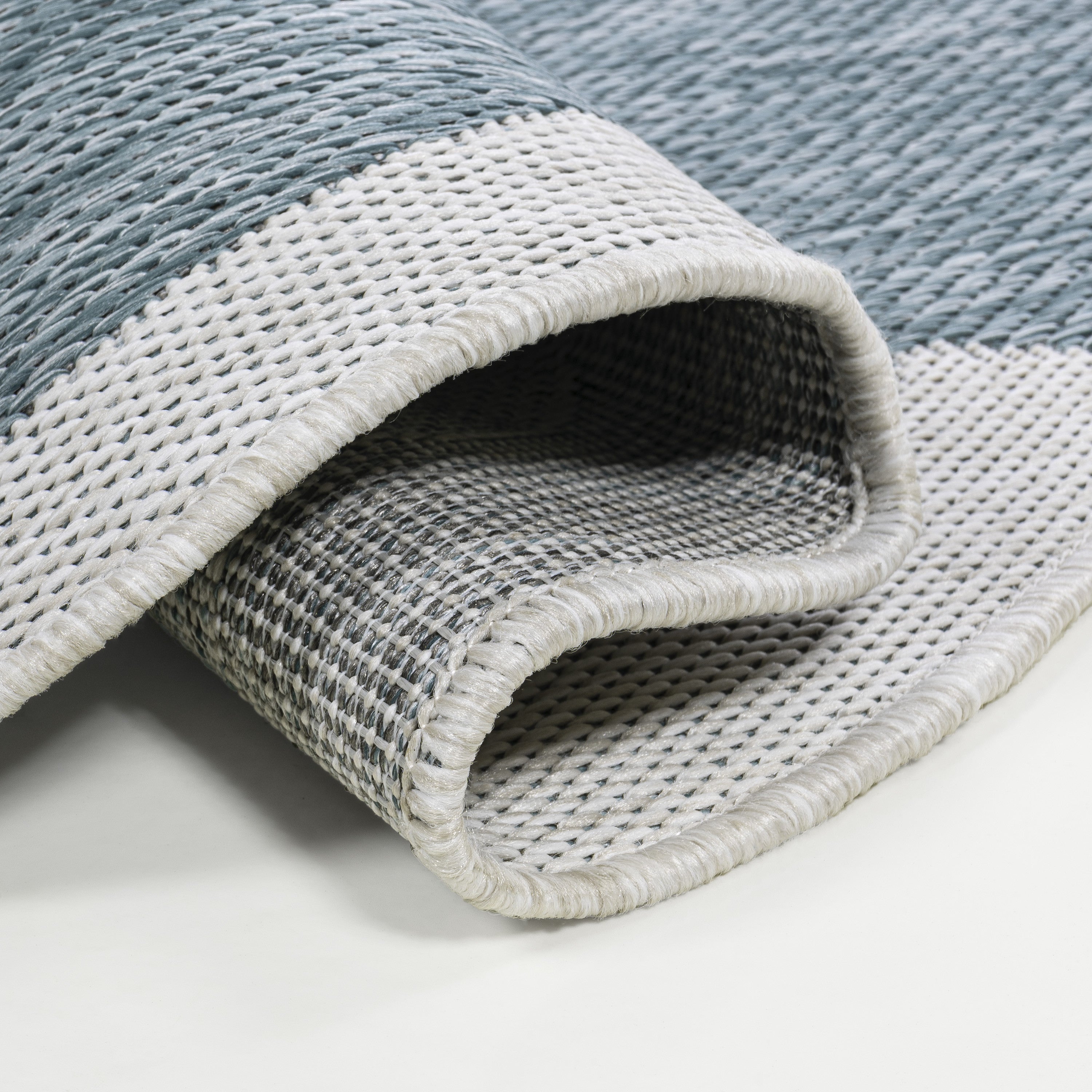 Turquoise-and-cream indoor outdoor runner rug, rolled edge with textured weave