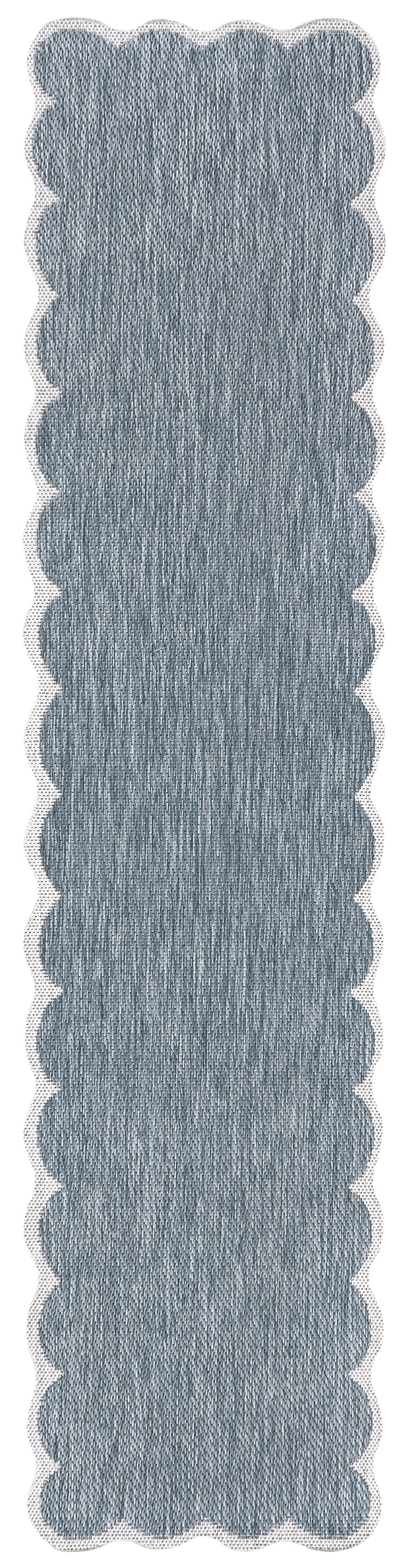 Blue indoor outdoor runner rug with scalloped edge and textured flat weave