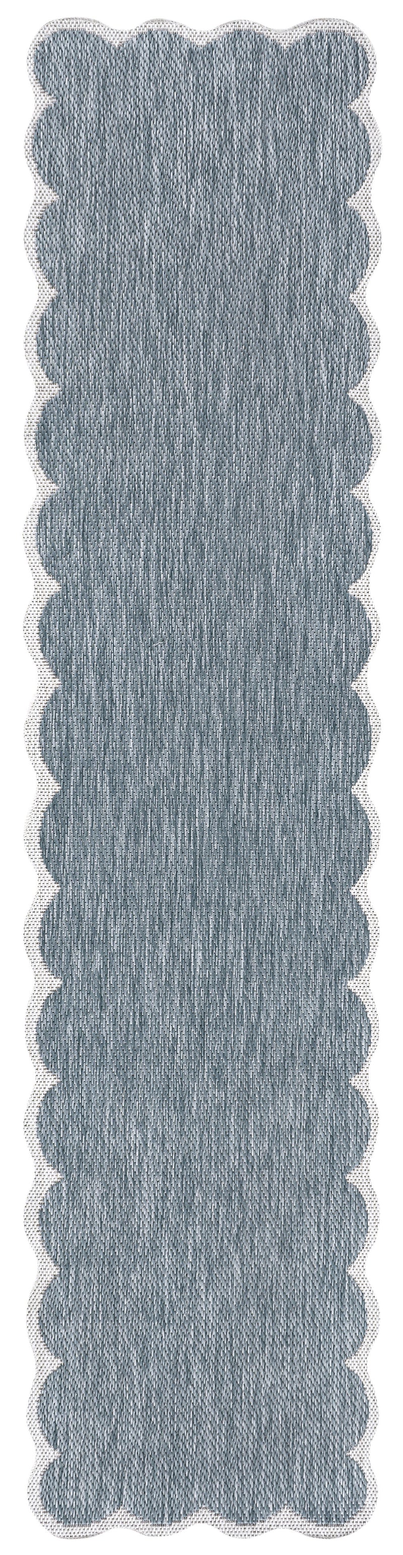 Blue indoor outdoor runner rug with scalloped edge and textured flat weave