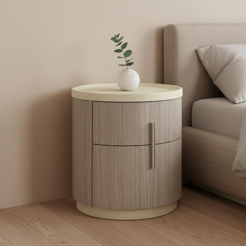 Round two-drawer nightstand with beige top and oak wood finish, center vertical pull