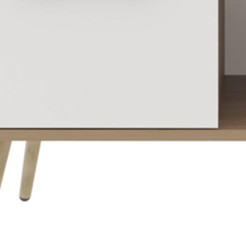 Brown wood coffee table underside with tapered legs and white drawer front