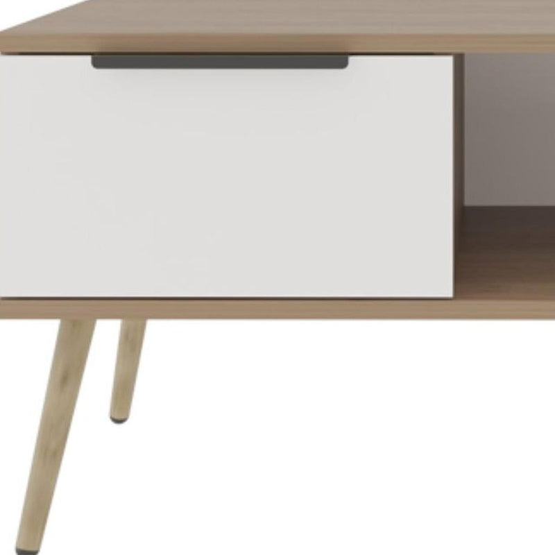 White drawer front with black handle under the brown tabletop edge