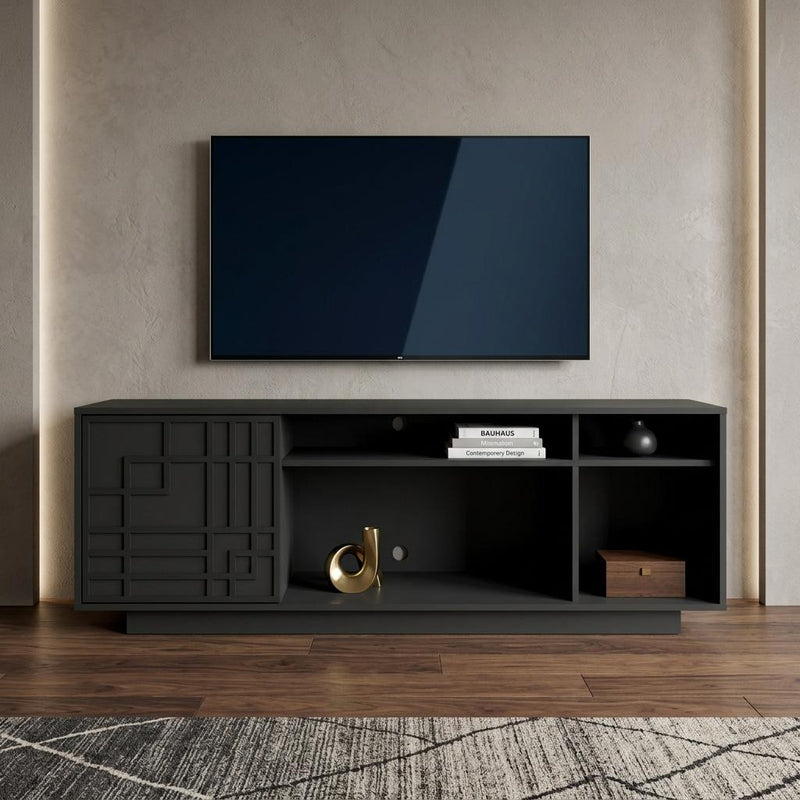 Black TV stand with carved geometric cabinet door and open media shelves