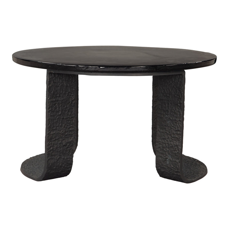 Black round pedestal coffee table with flat circular top and sculpted base