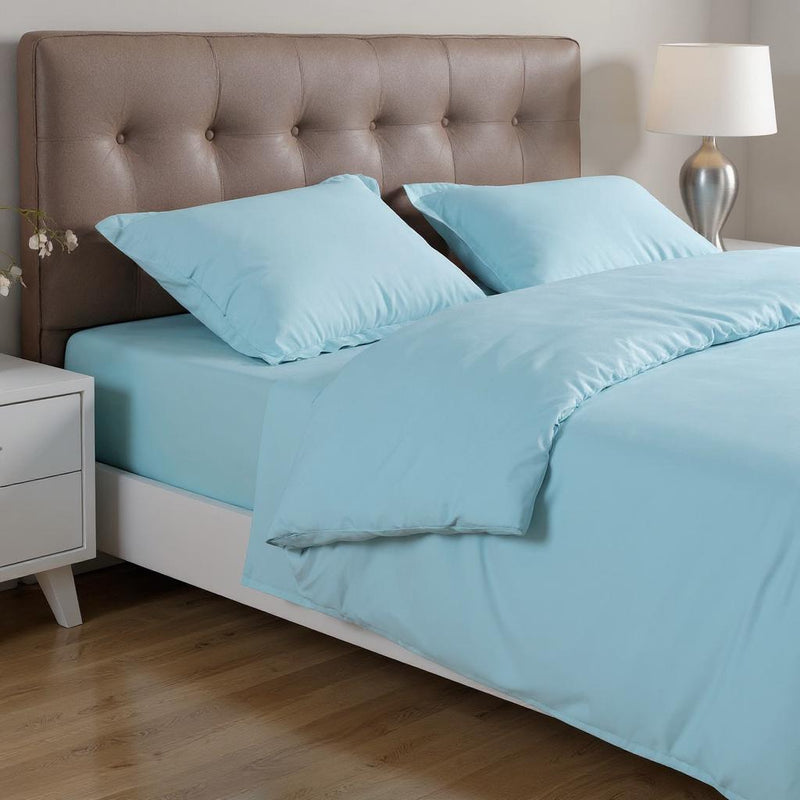 Light blue queen duvet cover set with two shams on bed