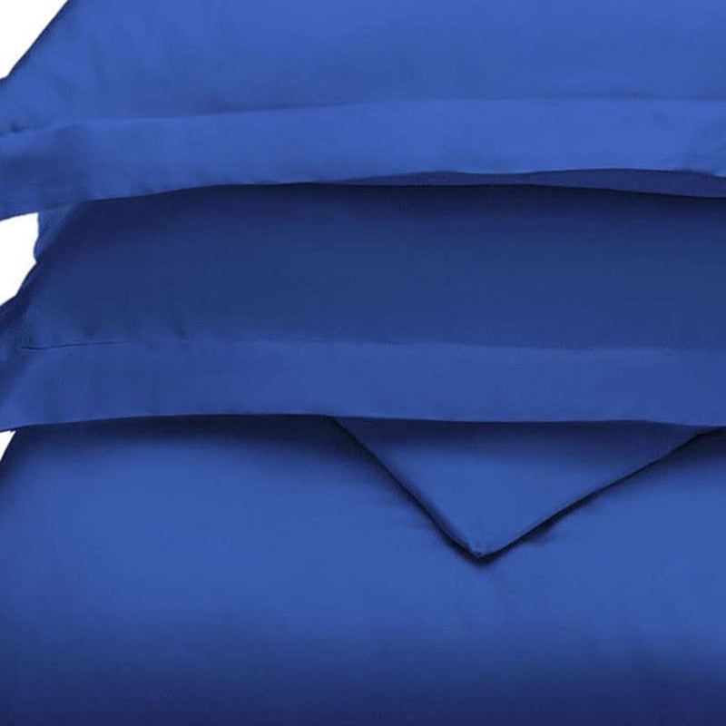 Blue duvet cover with overlap edge and stitched seam, close-up