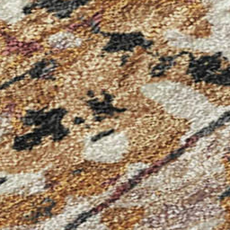 Abstract rug close-up with cream, rust-orange, and dark charcoal mottled texture.