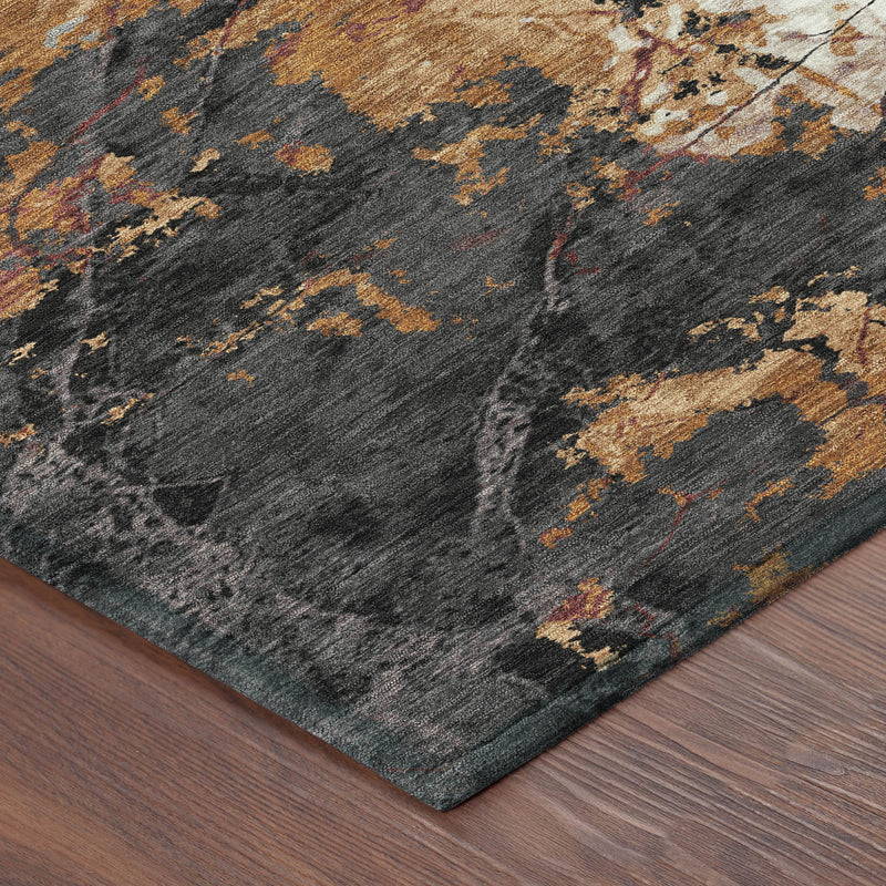 Abstract area rug corner with dark gray base and copper-orange flecks and accents.
