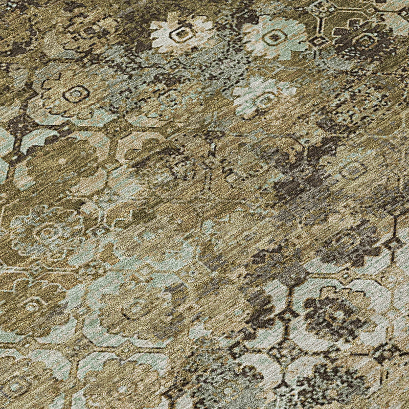 Round area rug close-up of muted abstract geometric pattern in khaki, olive, dark gray