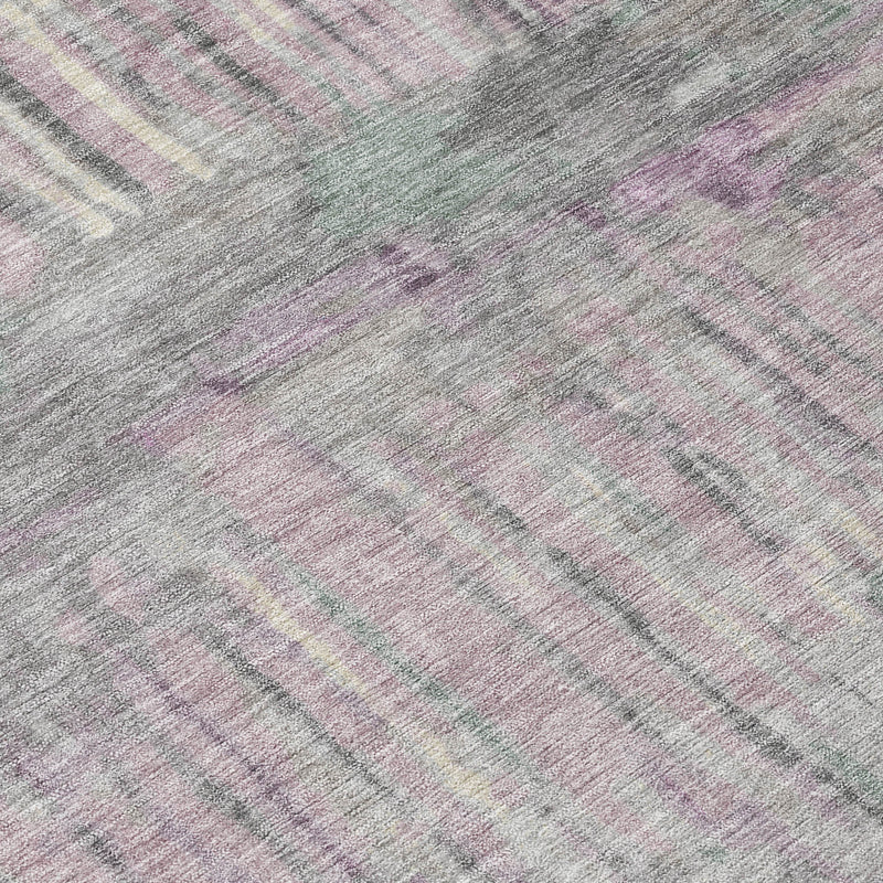 Abstract area rug surface detail in lavender and plum with muted striped pattern.