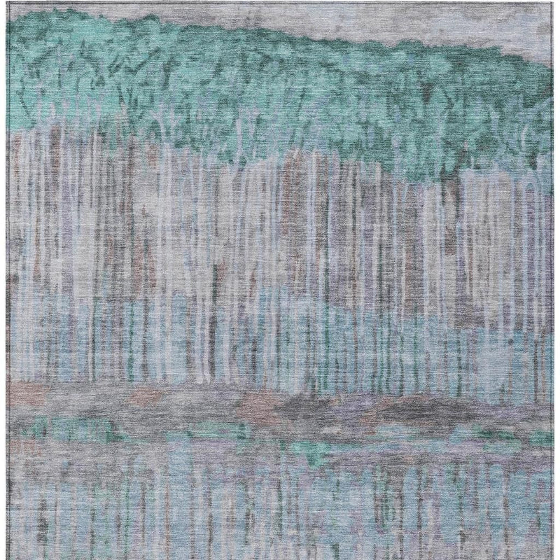 Abstract area rug close-up with teal top band and taupe vertical stripe-like texture