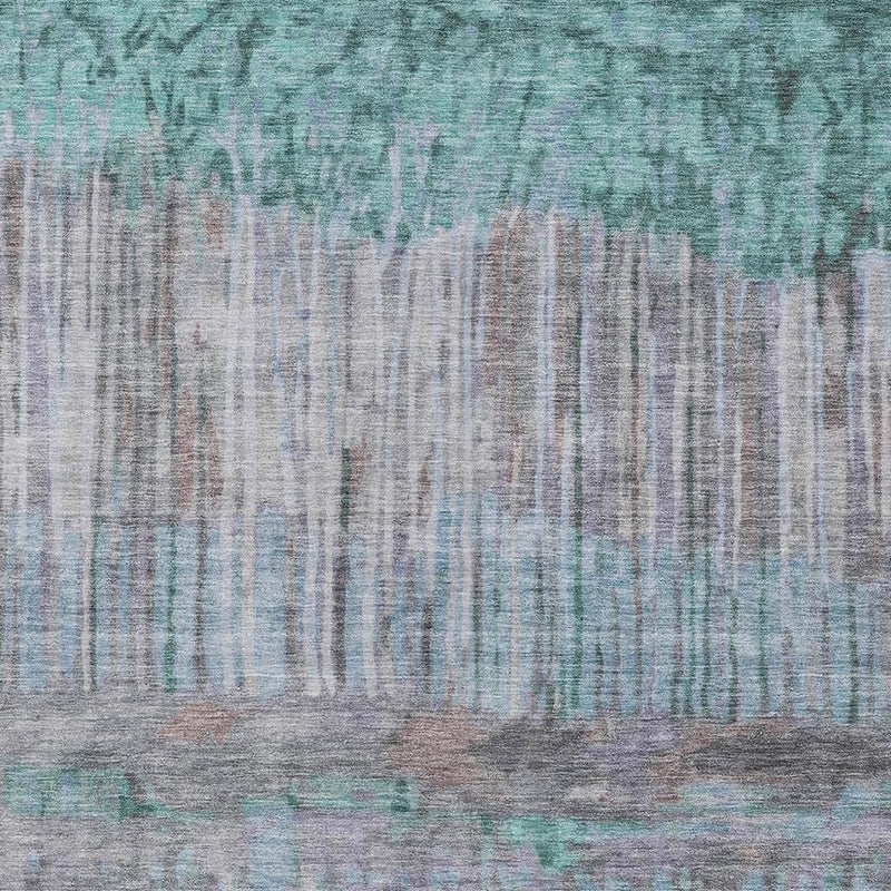 Abstract rug close-up showing teal and taupe faded lines with textured, brush-stroke look