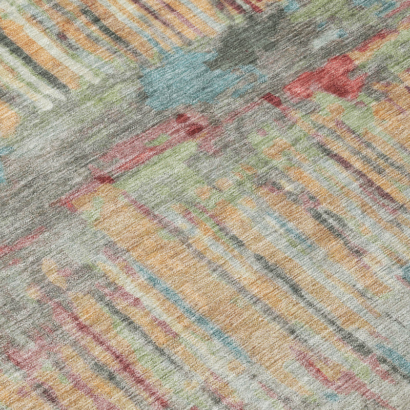 Round abstract area rug close-up with multicolor washed stripe pattern.
