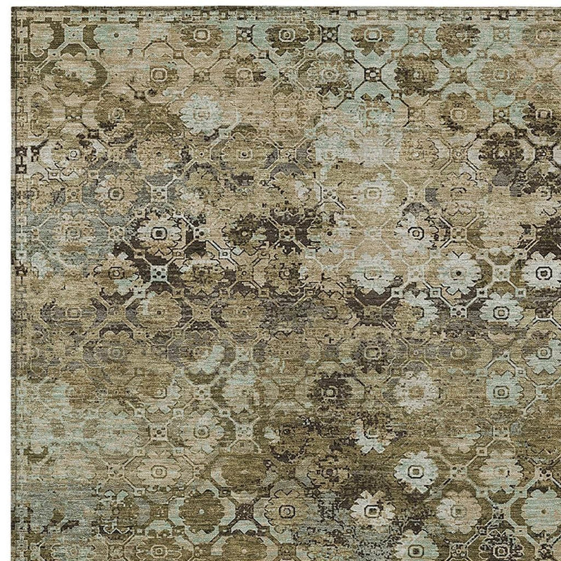 Abstract area rug close-up with khaki and olive distressed medallion motif.