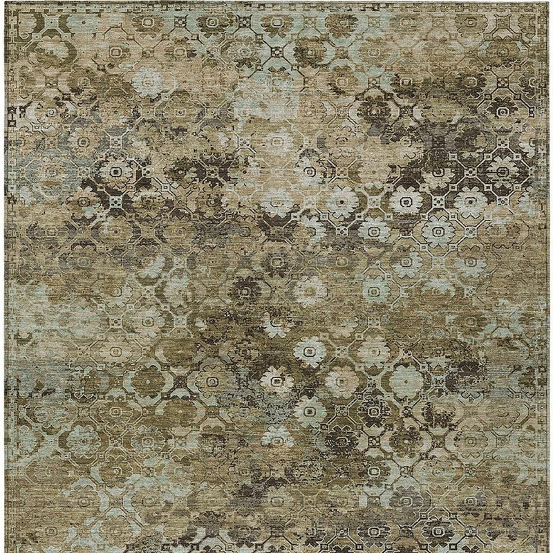 Abstract area rug in khaki, olive, and teal with scattered geometric medallion pattern.
