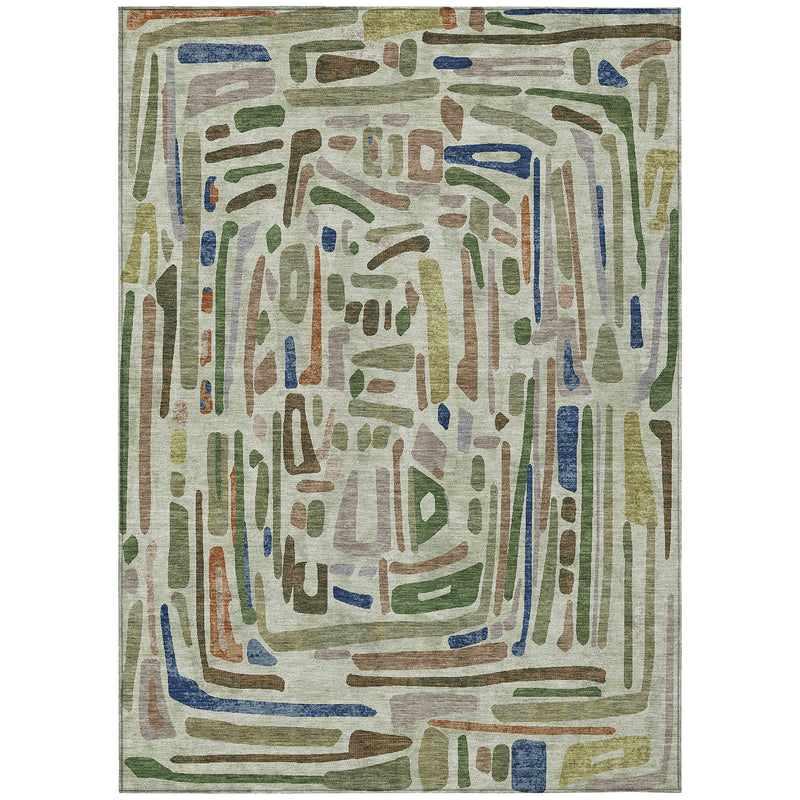 Green abstract washable area rug with framed geometric drip design on light cream.