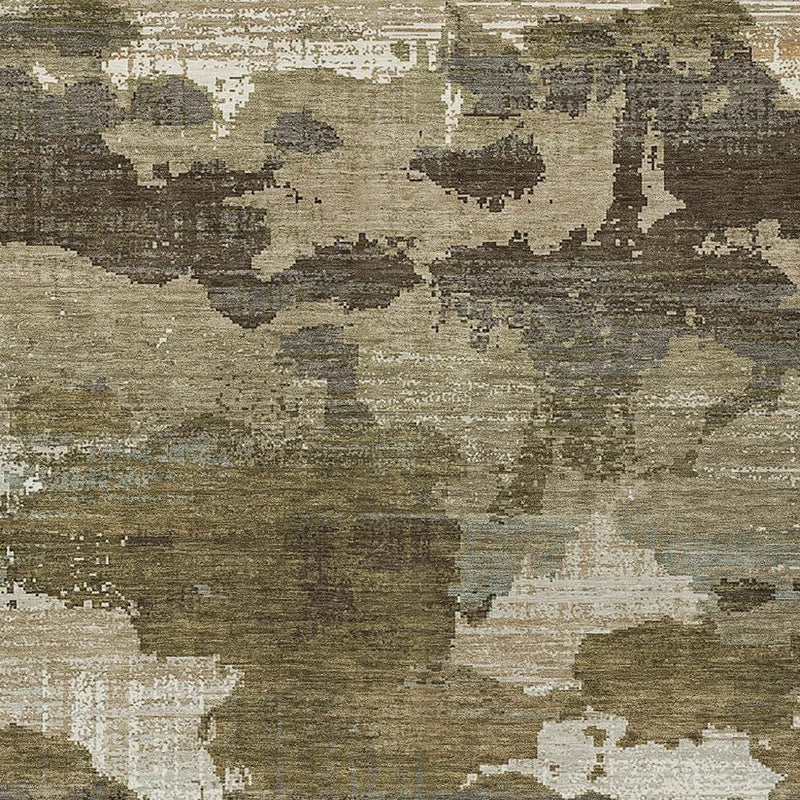 Close-up khaki and beige abstract washable area rug with distressed texture.