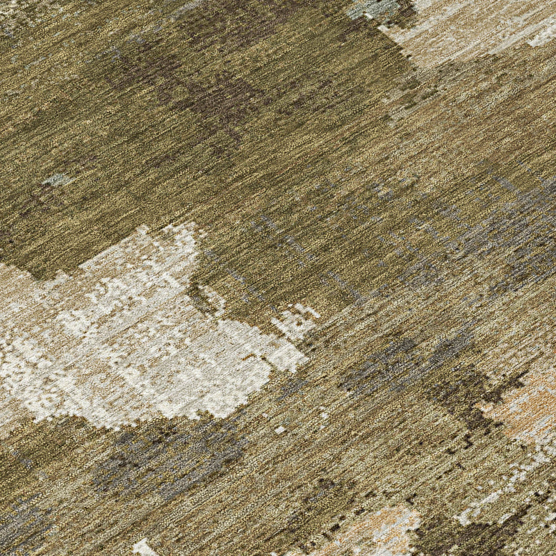 Abstract area rug with olive ground and beige distressed shapes, close-up texture