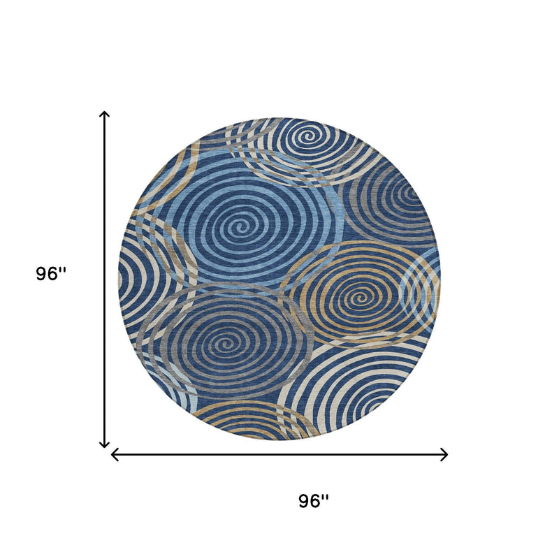 Round area rug in blue and tan with concentric circle geometric design