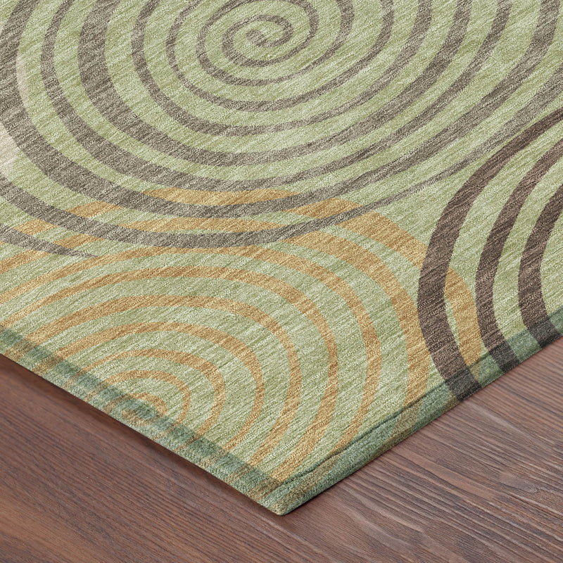 Area rug corner with finished edge and multicolor spiral circle pattern in green and taupe