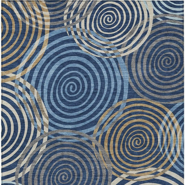 Geometric area rug with navy, denim blue and beige spiral circles pattern