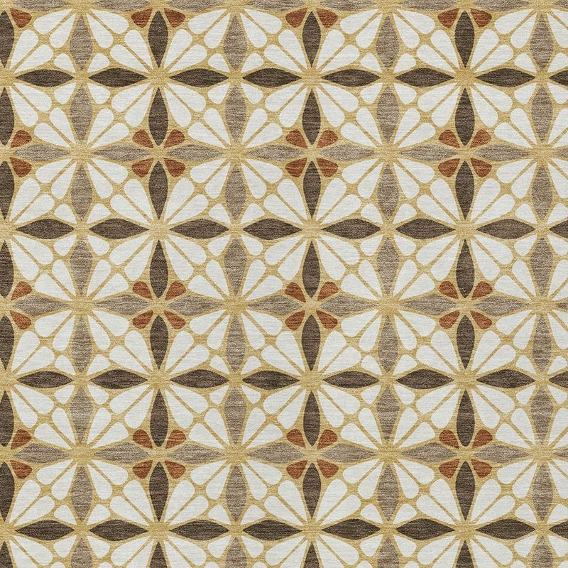 Geometric area rug close-up with starburst medallions in cream and gold-brown hues