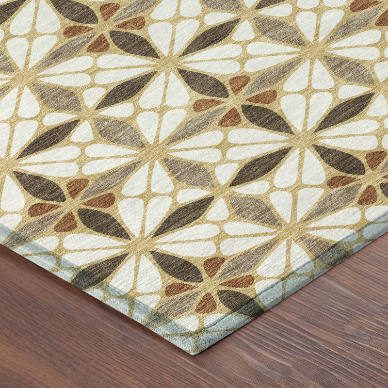 Geometric area rug corner with cream, gold, brown, and dark gray starburst motifs