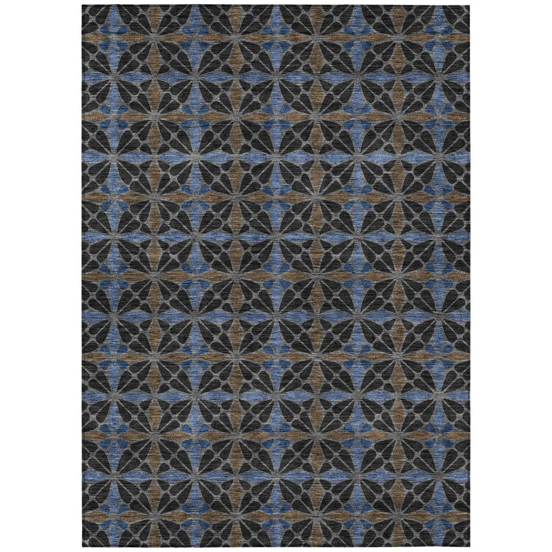 Rectangular geometric area rug with repeating star motif in dark gray, blue, and tan