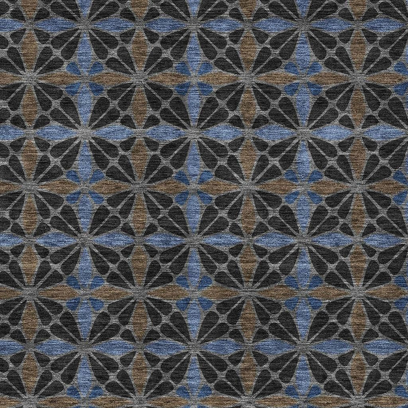 Geometric indoor outdoor rug featuring an all-over star pattern in charcoal, blue, and tan