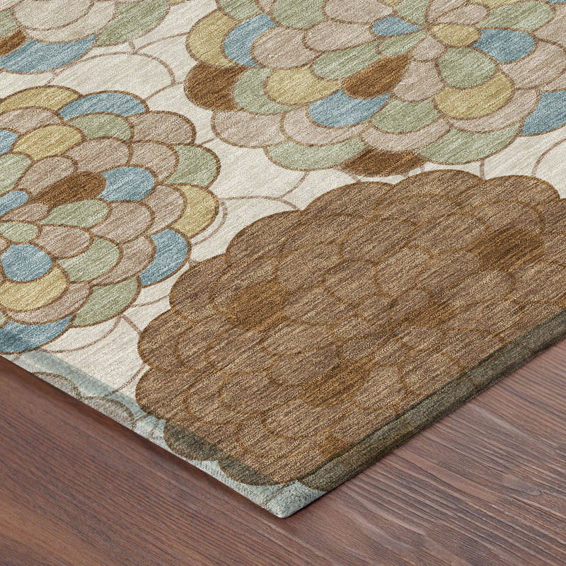 Corner of round indoor-outdoor rug showing multicolor floral pattern and bound edge