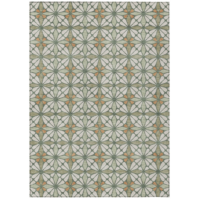 Geometric washable area rug with cream base and repeating green starburst pattern with orange accents