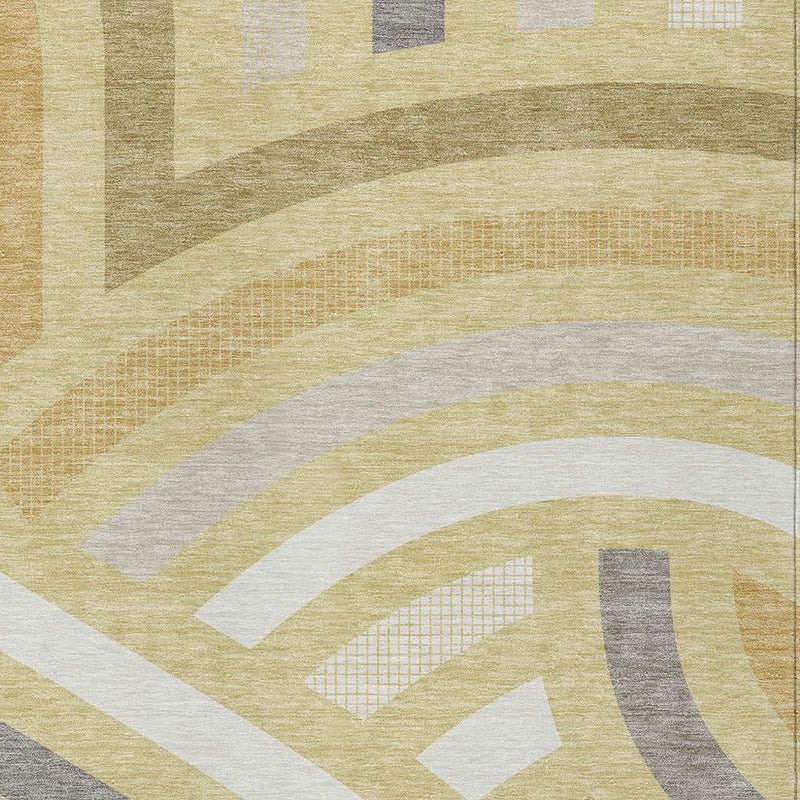 Close-up area rug showing abstract swirls and stripes in wheat, gold, gray, and white.