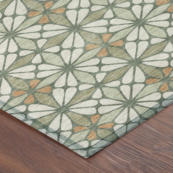 Geometric indoor outdoor area rug with starburst pattern in green, white, and orange