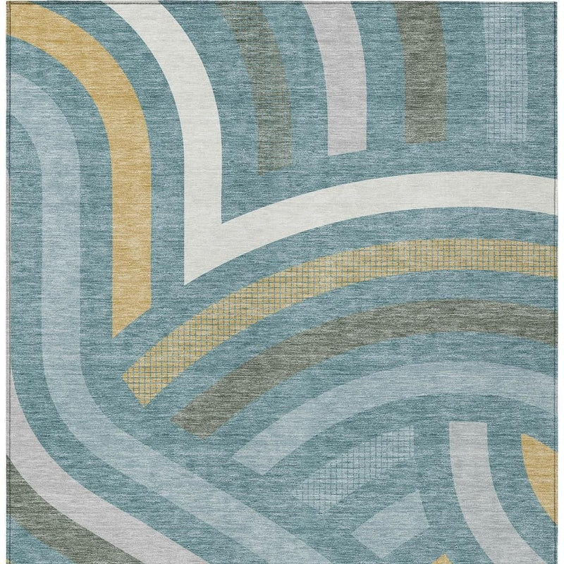 Abstract area rug with teal blue, white, and muted gold arch stripes