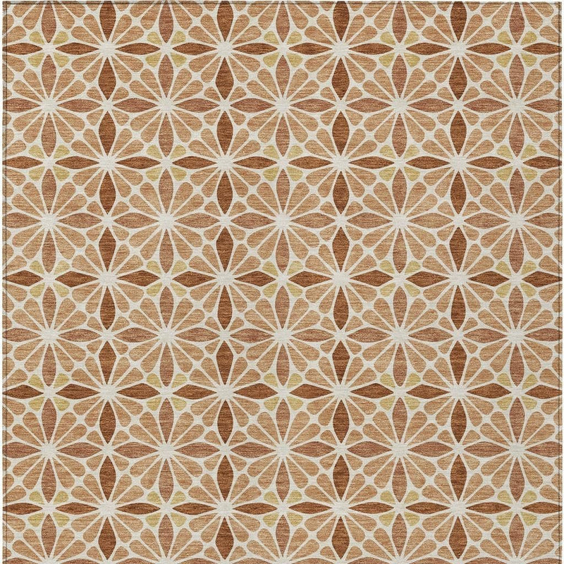 Flat woven rug with repeating geometric starburst pattern in copper, gold, and white.