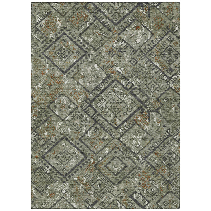 Full view of green geometric area rug with diamond grid pattern and orange accent dots