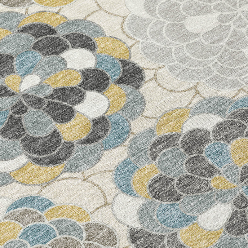 Close-up of ivory area rug floral medallions with gray, blue and yellow details