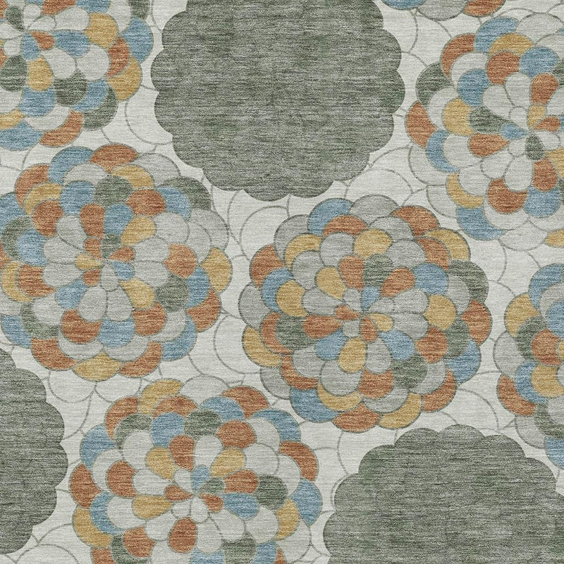 Floral area rug with overlapping flower medallions in gray, blue, tan, and orange on light