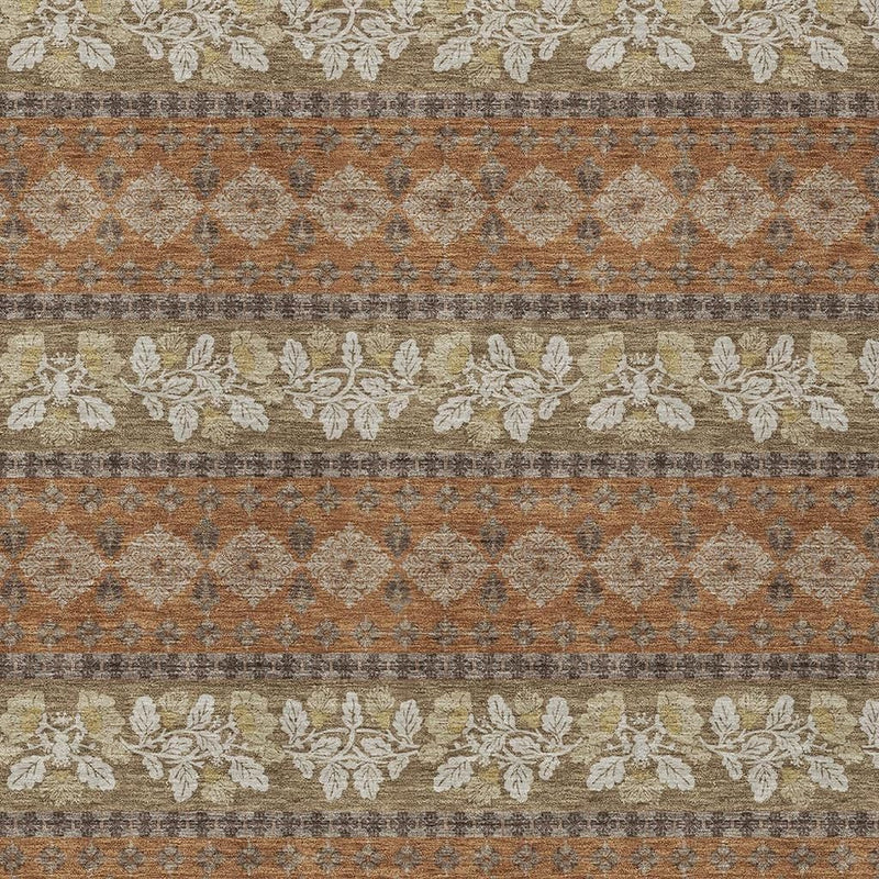 Striped area rug closeup with orange, beige, and gray rows of floral accents