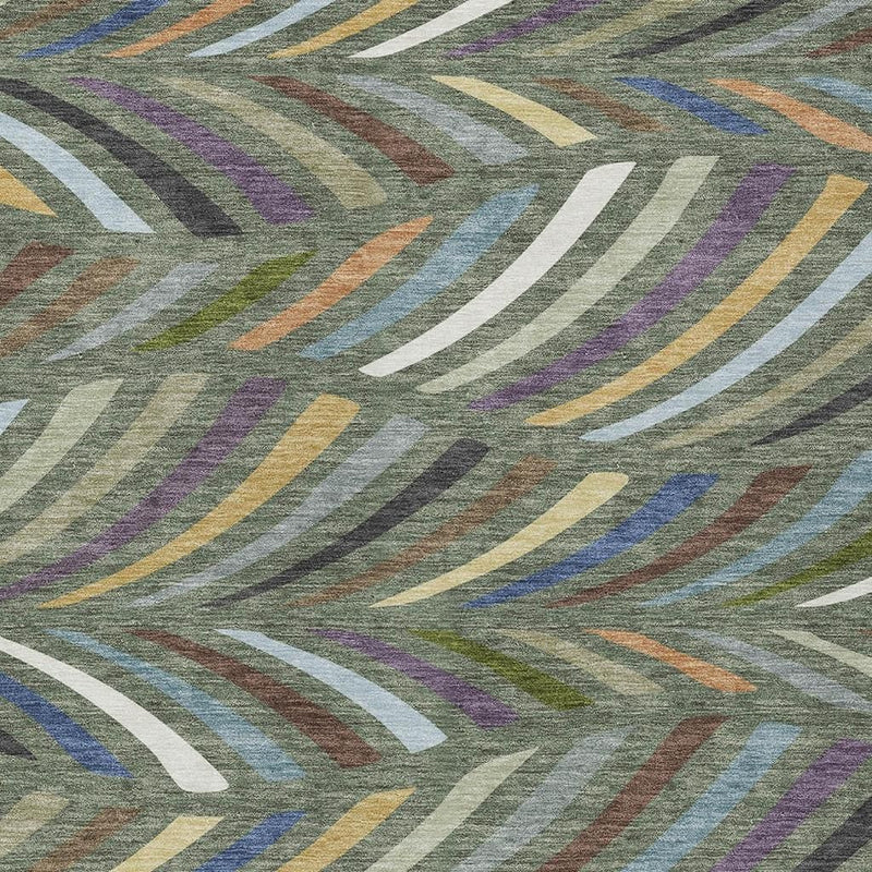 Abstract area rug close-up with multicolor curved stripe pattern on gray-green background