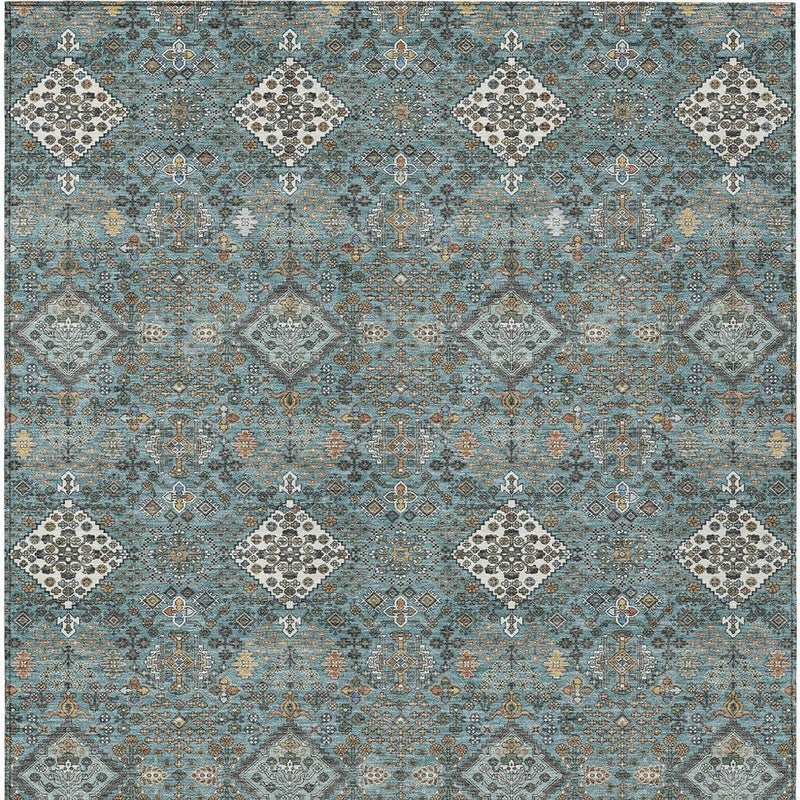 Teal blue geometric area rug pattern with gray and ivory diamond accents
