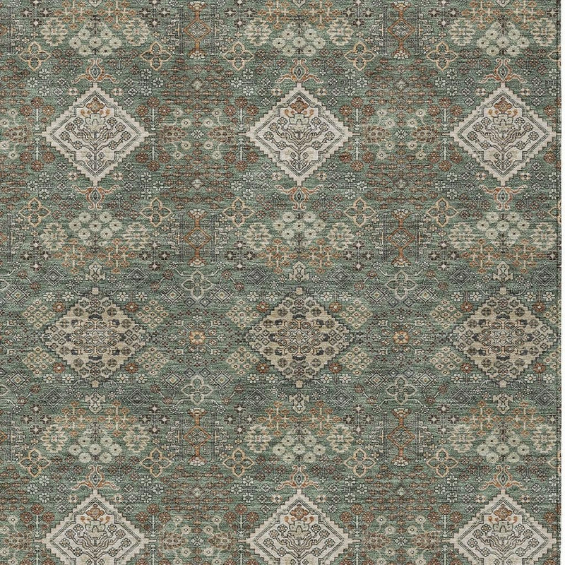 Green and taupe geometric area rug with repeating diamond lattice and medallions.