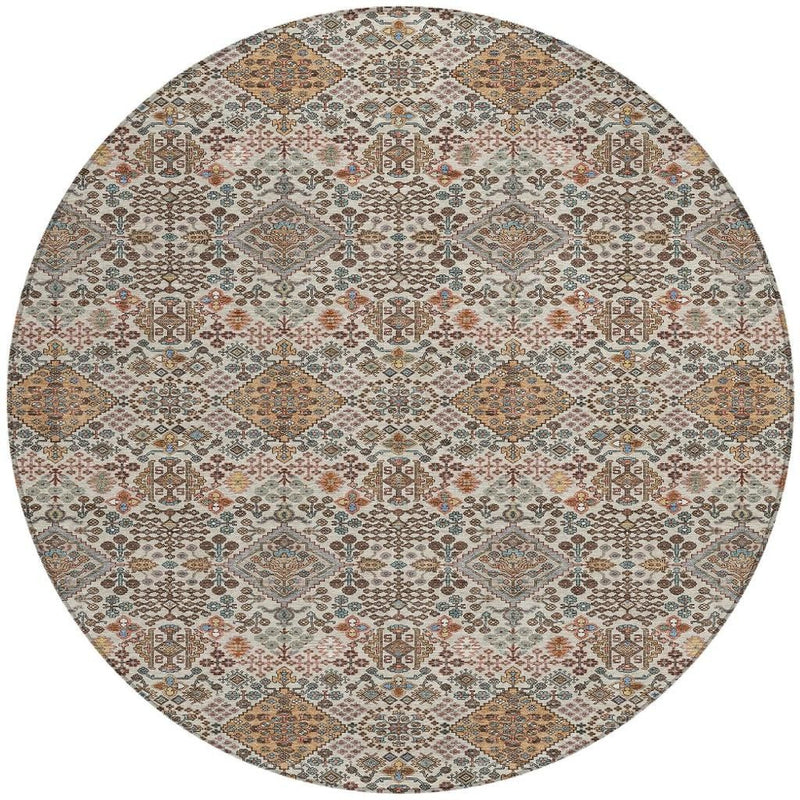 Beige round geometric washable area rug with copper, blue, and rust details
