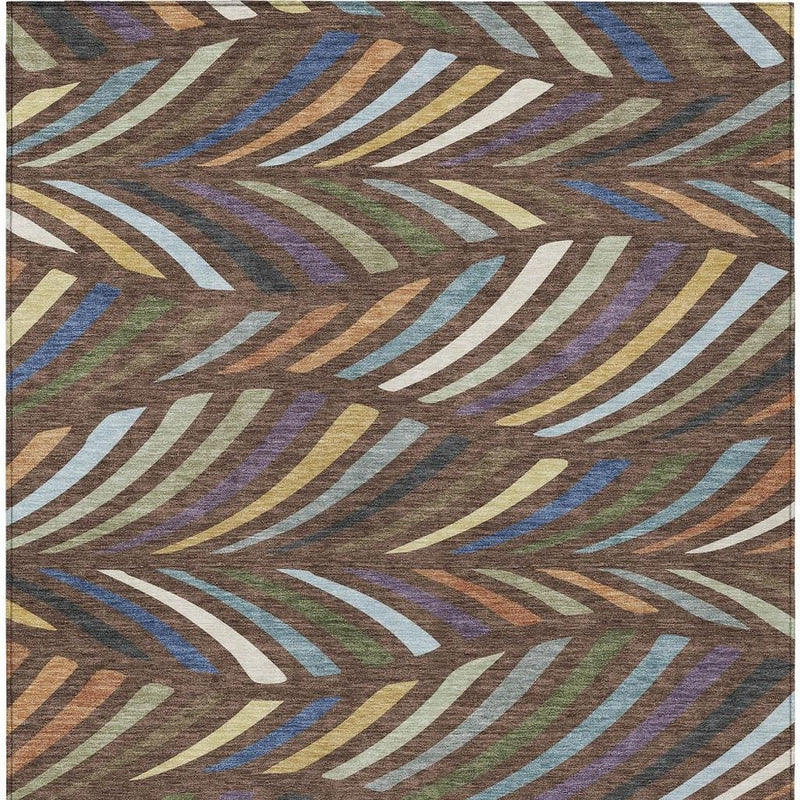Abstract area rug with layered curved stripe shapes in blue, plum, yellow, and green on brown
