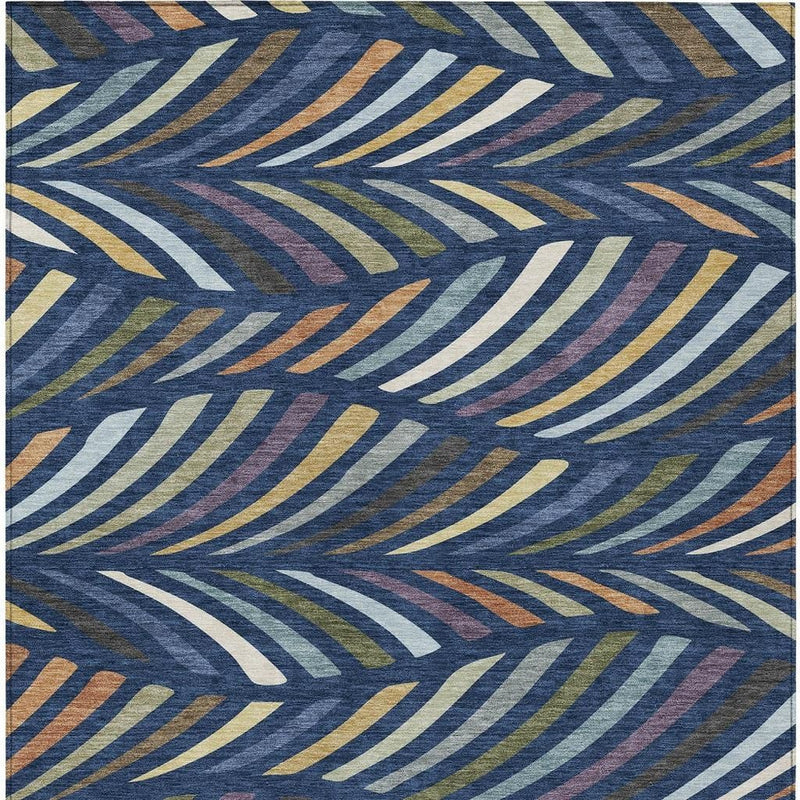 Rectangular area rug with abstract blue, gold, and cream wave-like line design