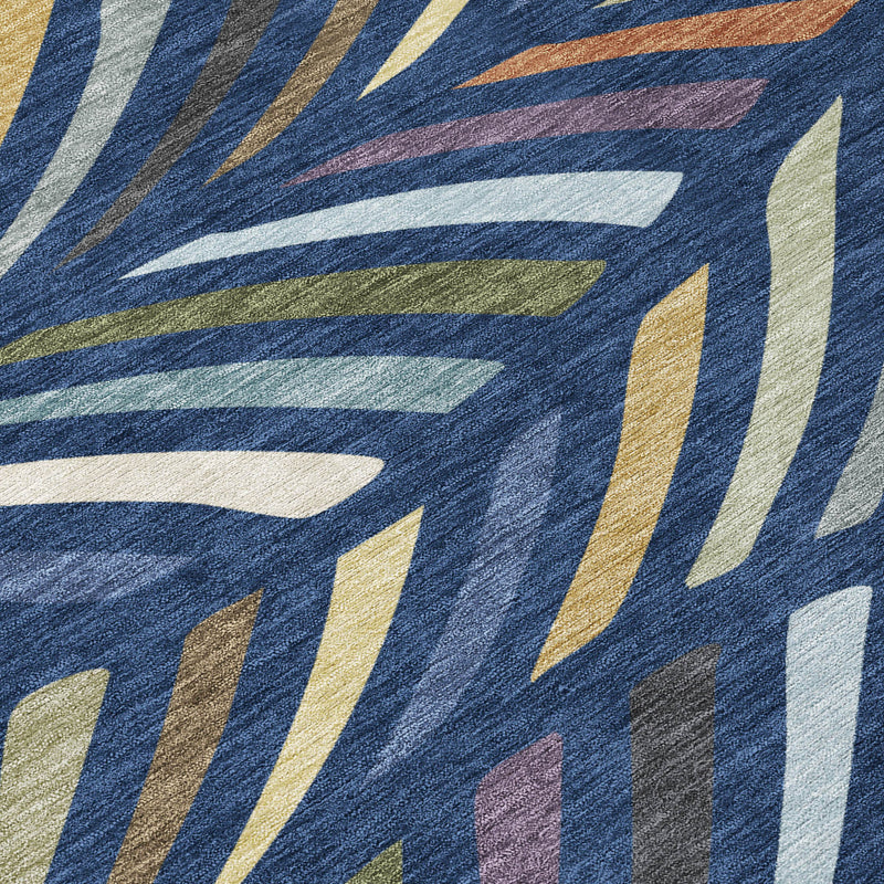 Close-up of navy blue abstract rug with multicolor striped fan shapes