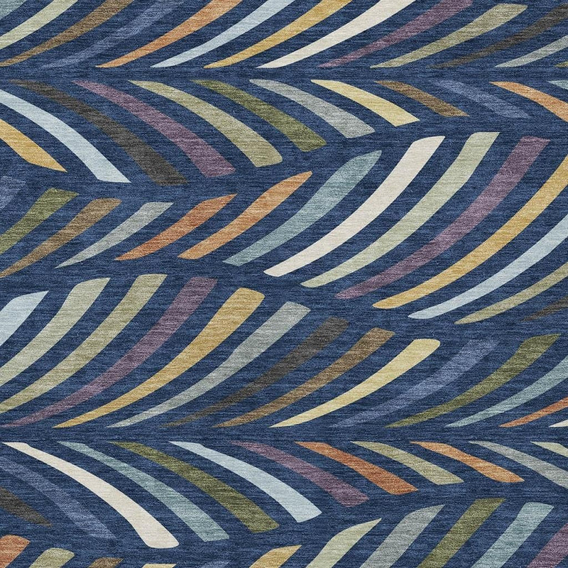 Area rug with dense abstract navy pattern and muted gold, cream, and rust accents