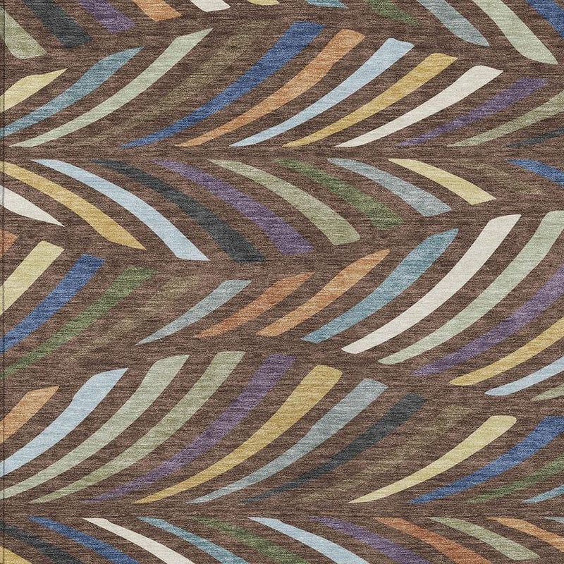 Close-up of brown abstract area rug with multicolor diagonal fan stripes and white outlines