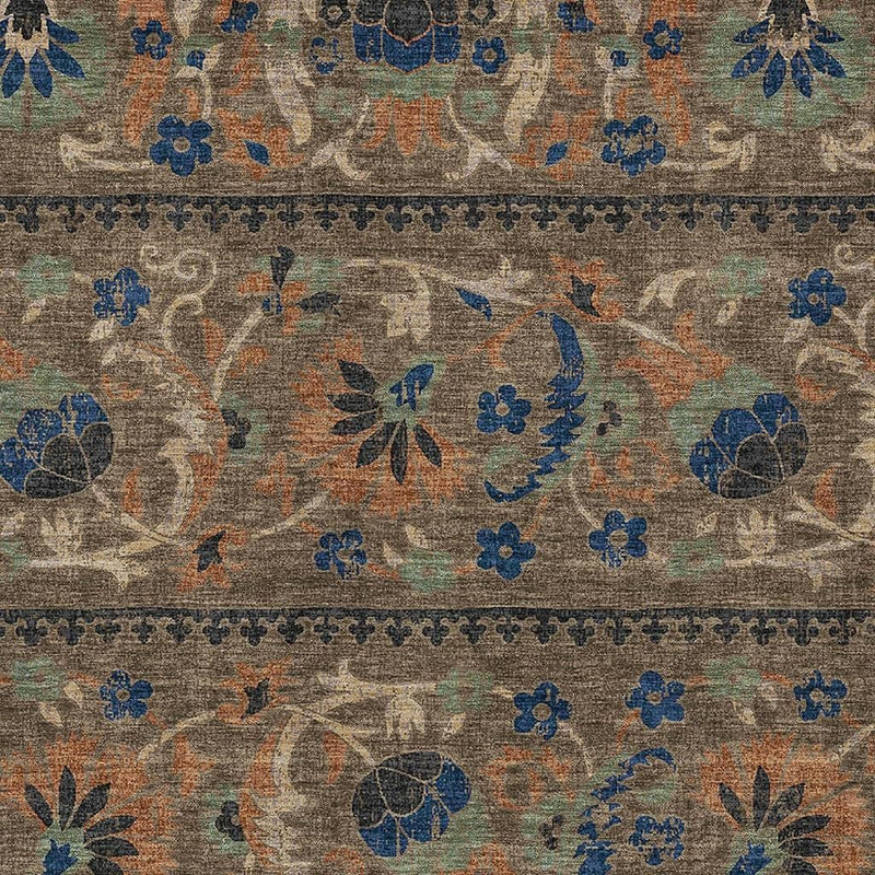Close-up of multicolor floral area rug pattern with blue and orange motifs on brown base